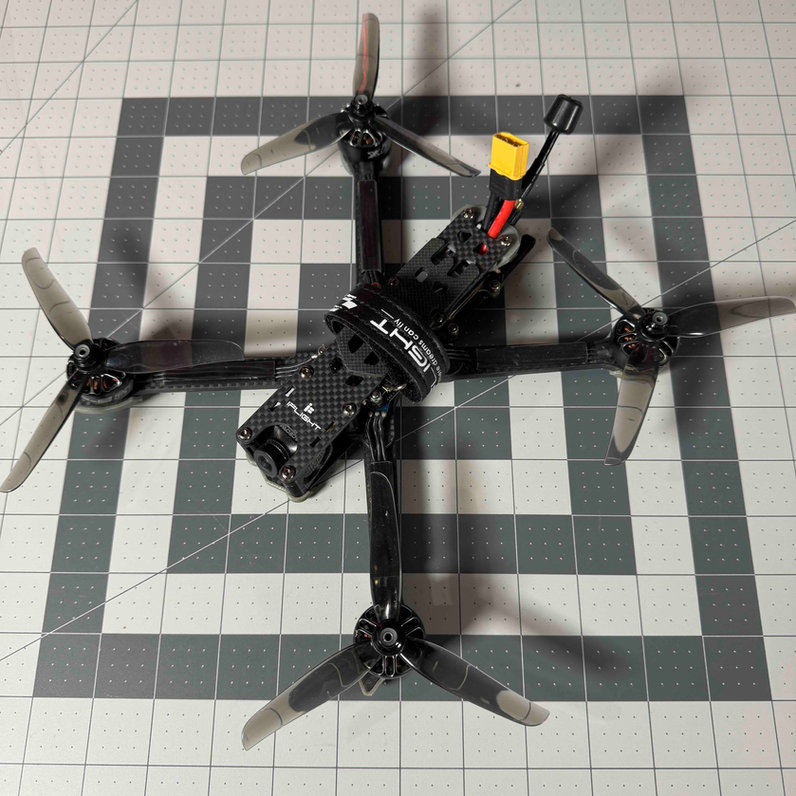 FPV drone on workbench — let us get you back in the air