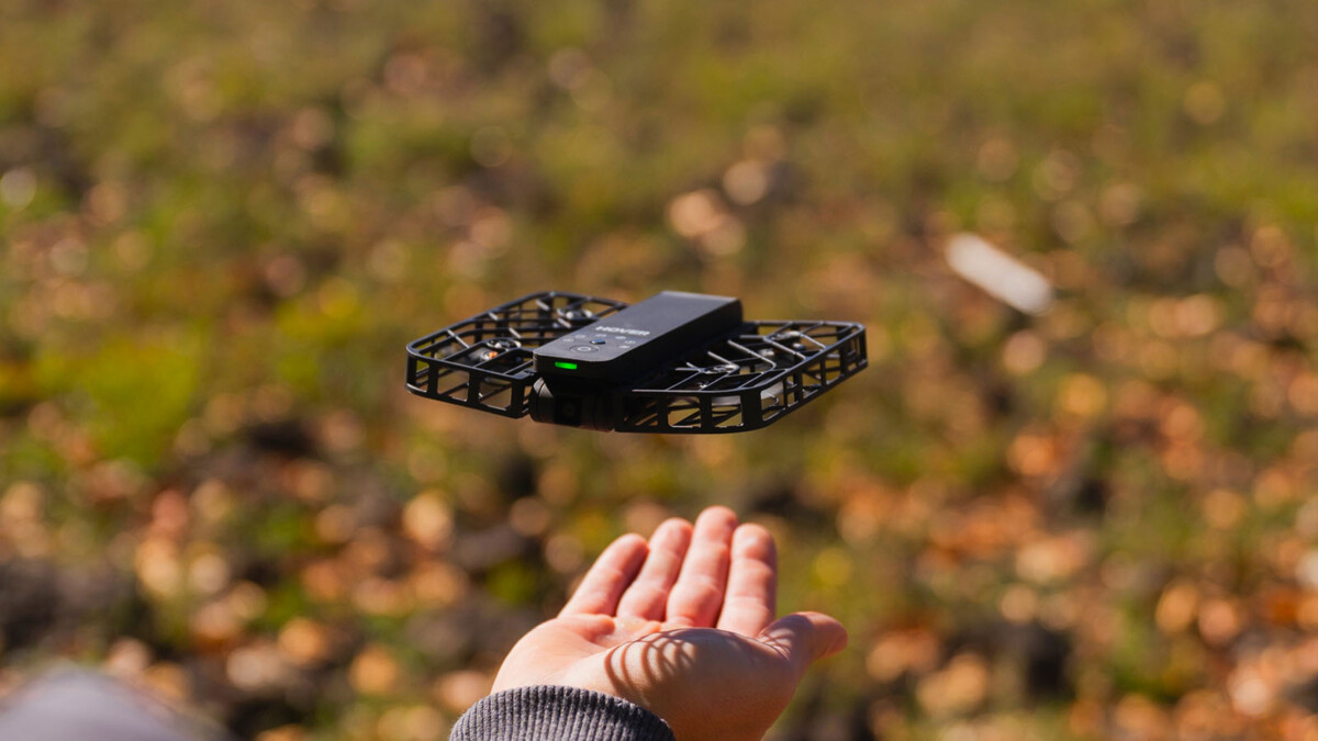 Small palm-sized selfie drone hovering