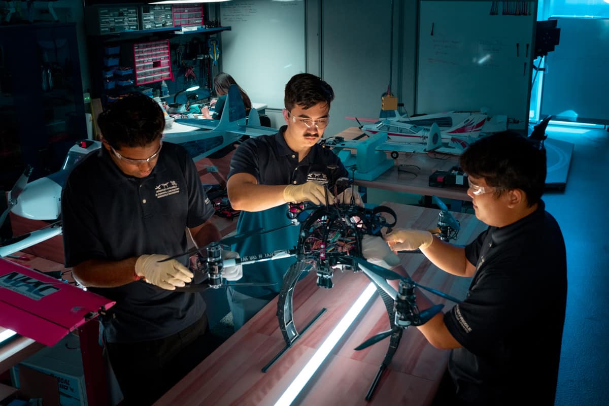 Engineers testing a drone in a research lab