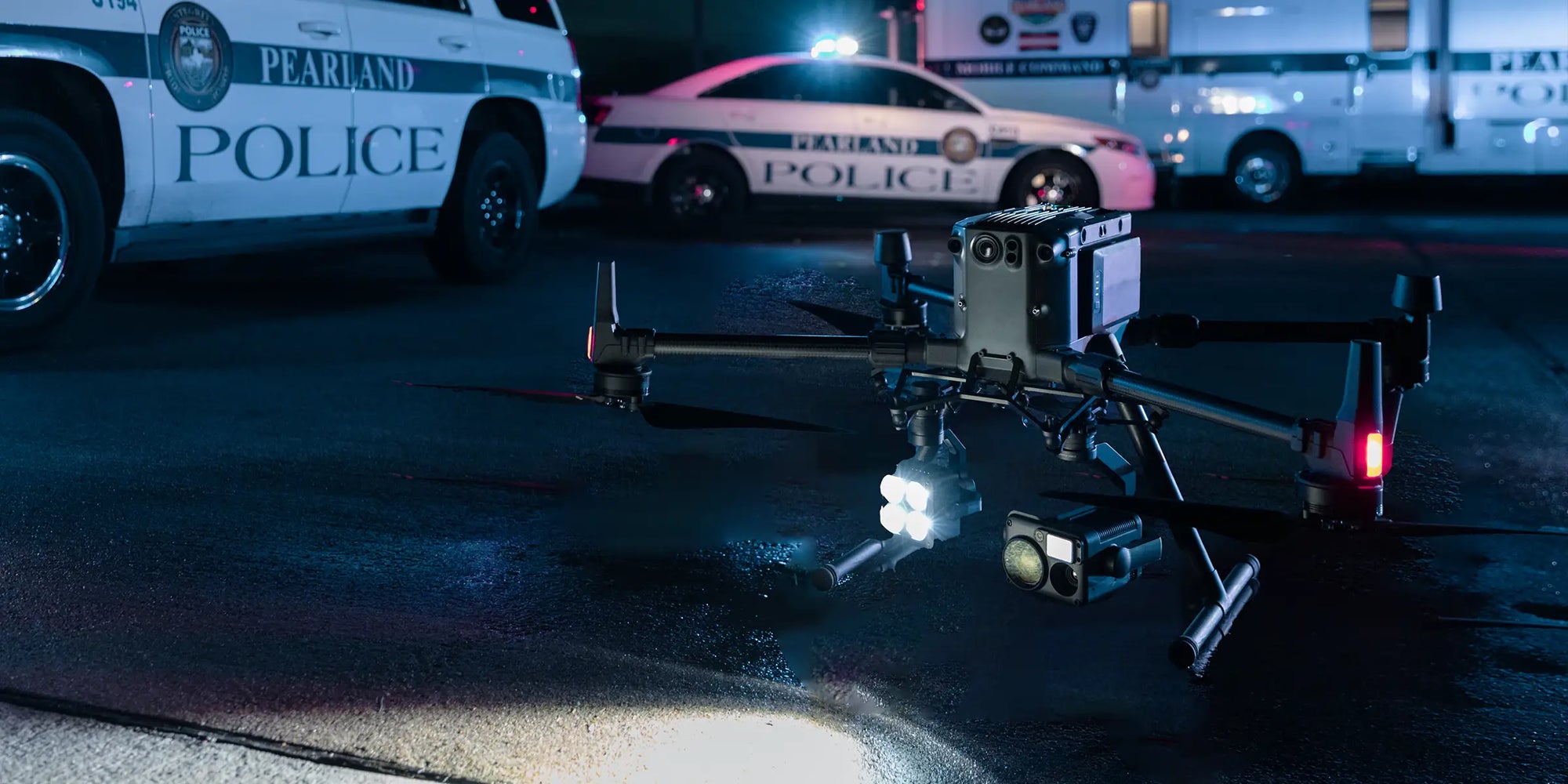 Police drone with spotlight at night