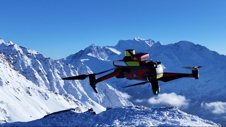 Search and rescue drone over snowy mountains